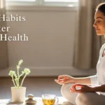 Better Mental Health: 9 Simple Habits That Actually Work Woman meditating at home with tea and plant, practicing simple habits for better mental health and emotional well-being.